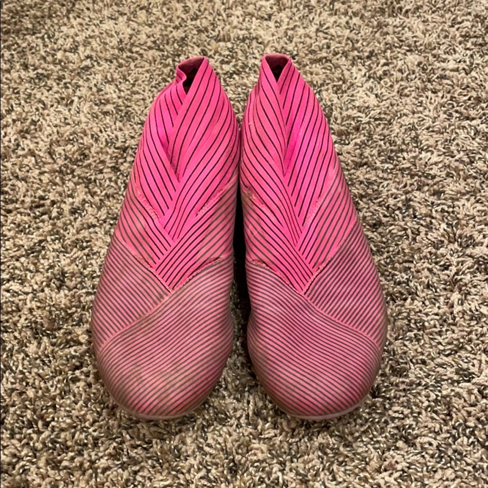 Pink and black adidas messi soccer cleats